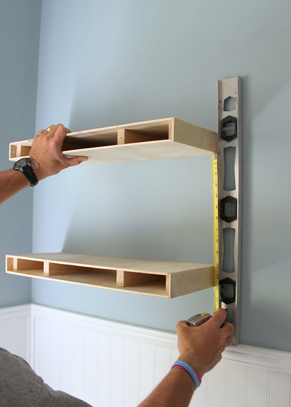 diy shelves measuring for placement of a second floating shelf in a diy floating shelves FTIBMAQ