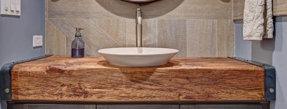 Thick wooden bathroom vanity top with vessel sink. Idea for third .
